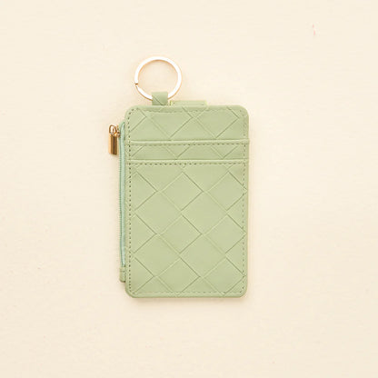 back view of sage Woven Keychain Wallet shown on a light beige background