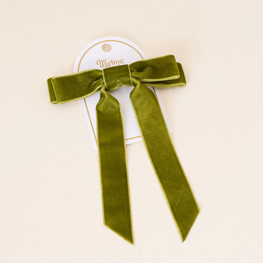 green velvet bow on its card packaging.