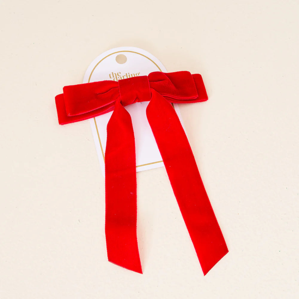 red velvet bow on card packaging.