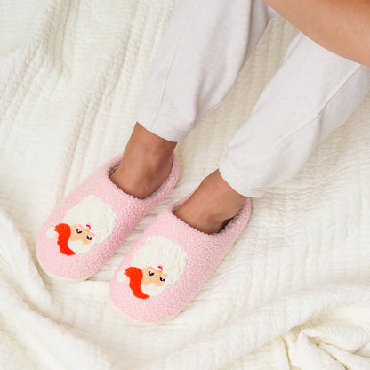 feet wearing pink Santa slippers.