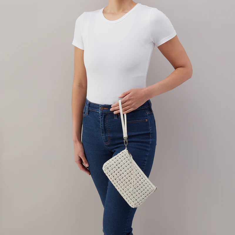 a person holding the darcy woven leather whitecap