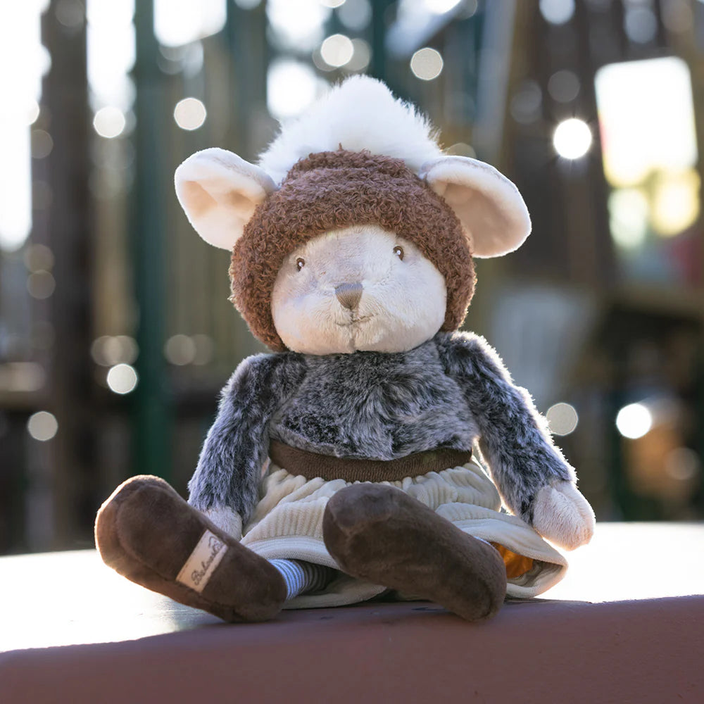 Winter Henry Plush Toy set on a bench