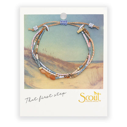 beaded bracelets in pastel hues of pinks, blues, and browns on card packaging