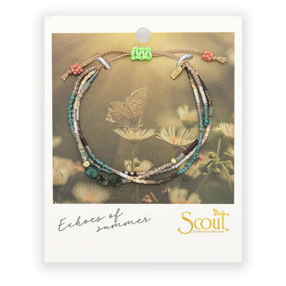 beaded bracelets in earthy hues of browns and blue on card packaging
