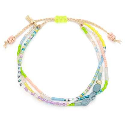 beaded bracelets in pastel hues hues shown on a white background