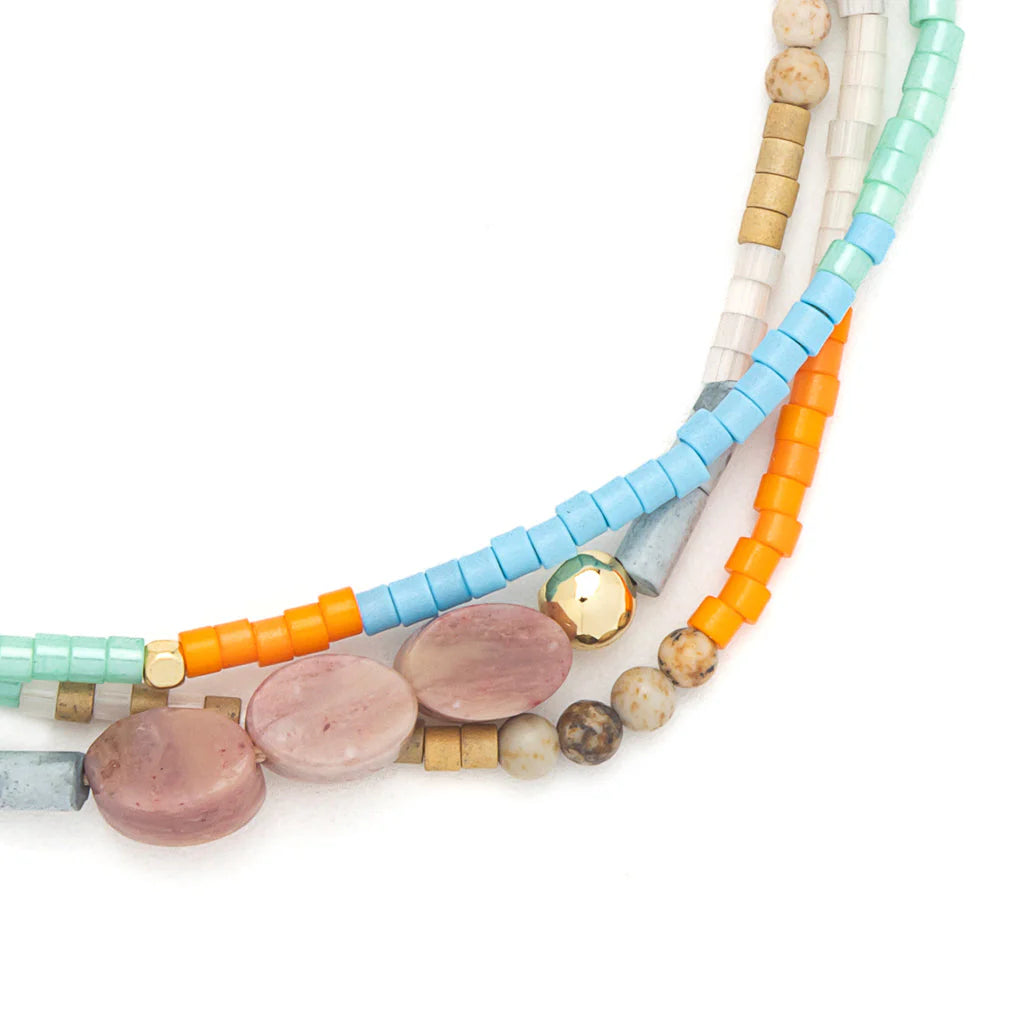 close-up of beaded bracelet on a white background