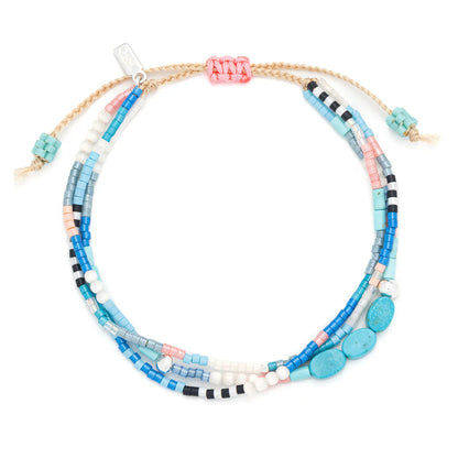 beaded bracelets in bright blue and teal hues shown on a white background

