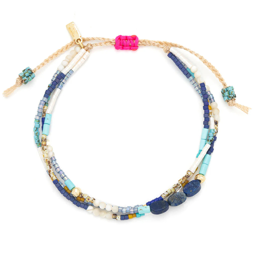 beaded bracelets in dreamy blue hues shown on a white background
