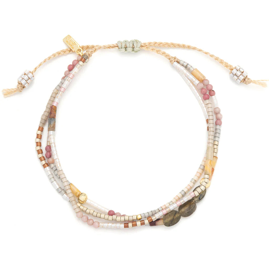 beaded bracelets in earthy brown and pink hues shown on a white background