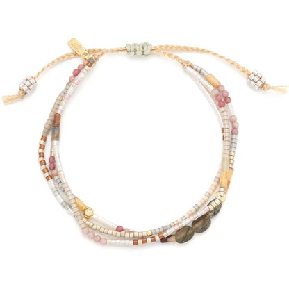 beaded bracelets in earthy brown and pink hues shown on a white background