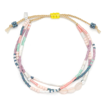 beaded bracelets in pink, purple, and white hues shown on a white background