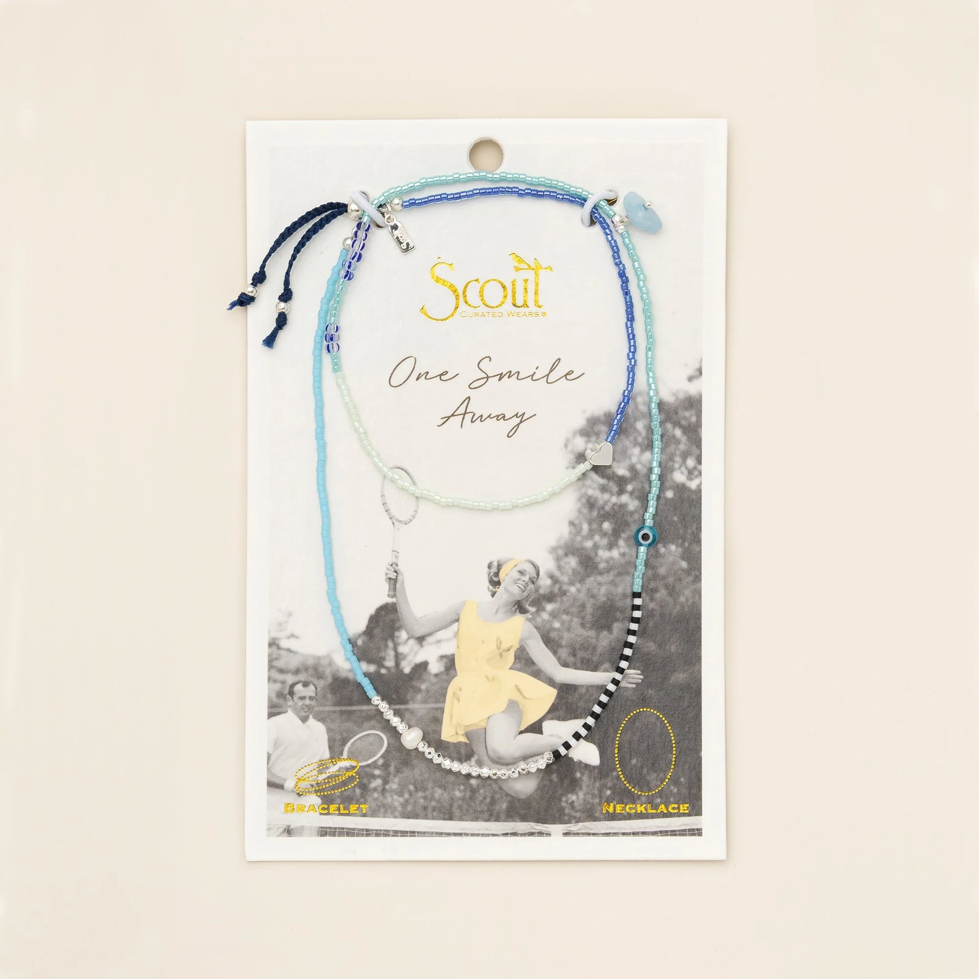 beaded wrap in dreamy hues of blues and white with accent beads on its card packaging
