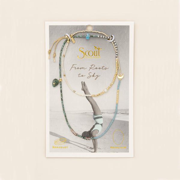 beaded wrap in blue, green, gold, and white hues with accent beads on its card packaging