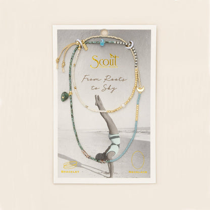 beaded wrap in blue, green, gold, and white hues with accent beads on its card packaging