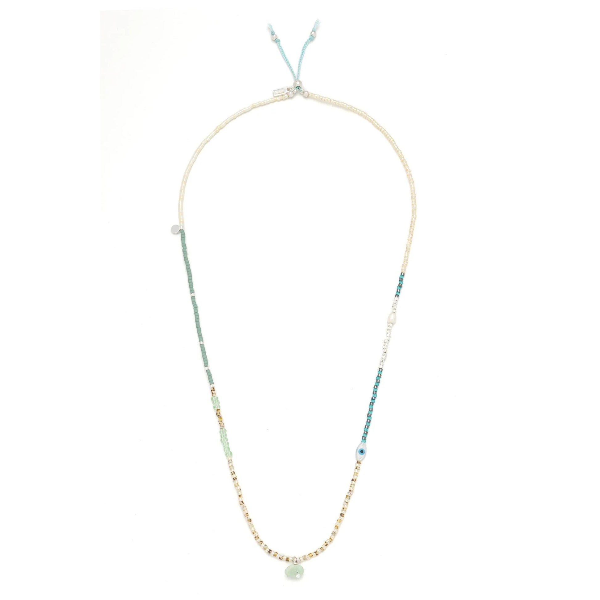 beaded wrap in dreamy green hues shown laying as a necklace on a white background

