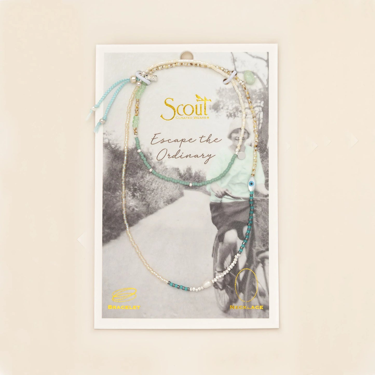 beaded wrap in dreamy green hues with accent beads on its card packaging
