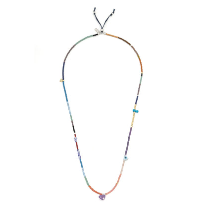beaded wrap in a rainbow of hues shown laying as a necklace on a white background

