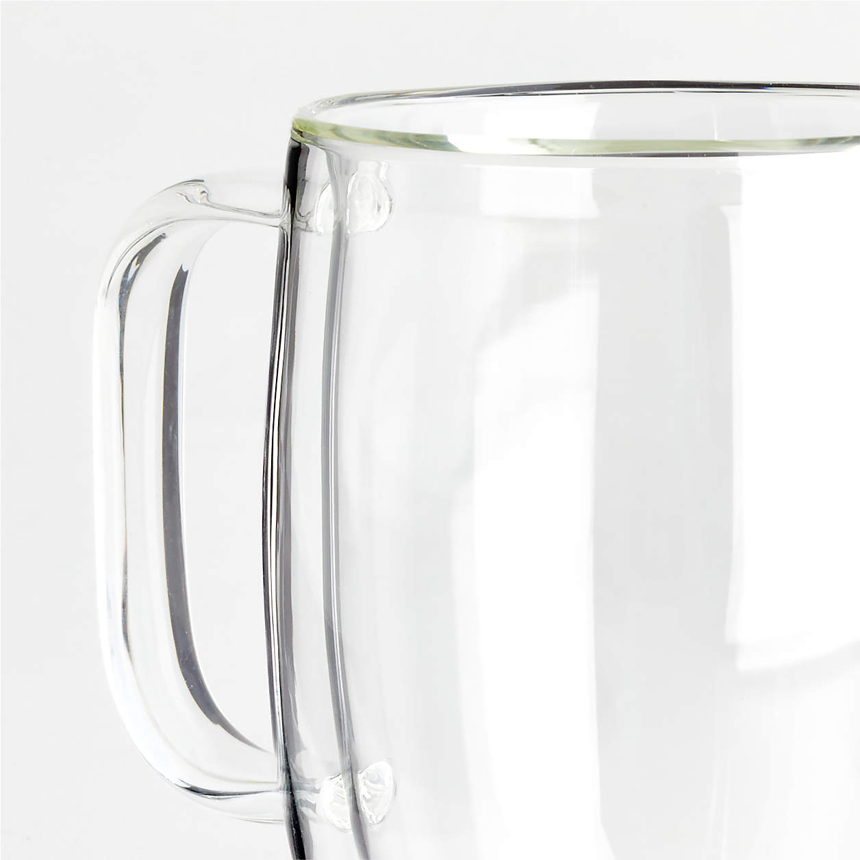 close-up of rim and handle of serrento mug.