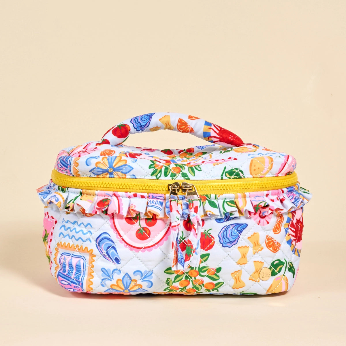 Colorful patterned cosmetic bag with a handle on a beige background