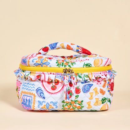Colorful patterned cosmetic bag with a handle on a beige background