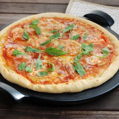 close-up of pizza on a smooth pizza stone.