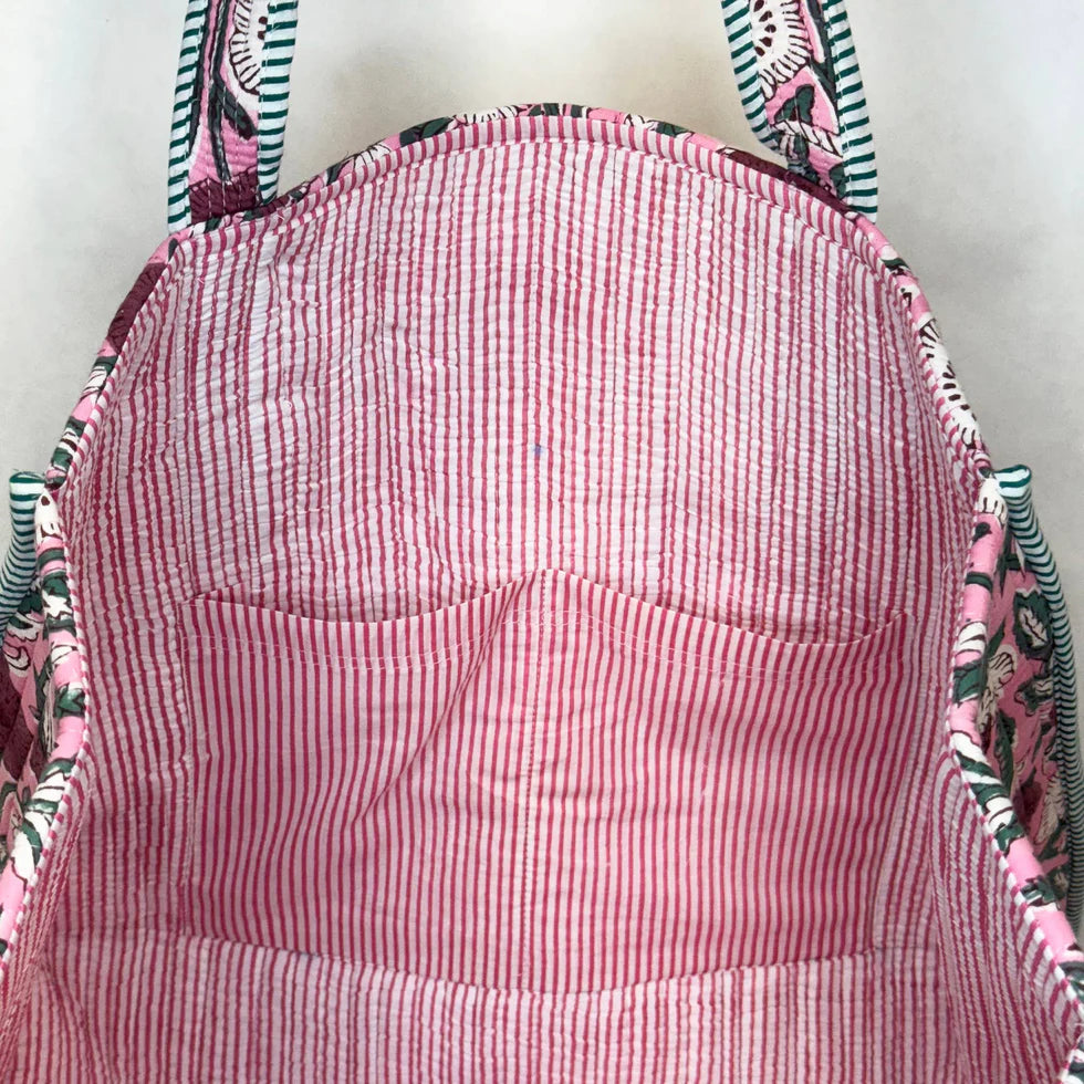 interior view of tote bag showing pink and white striped interior
