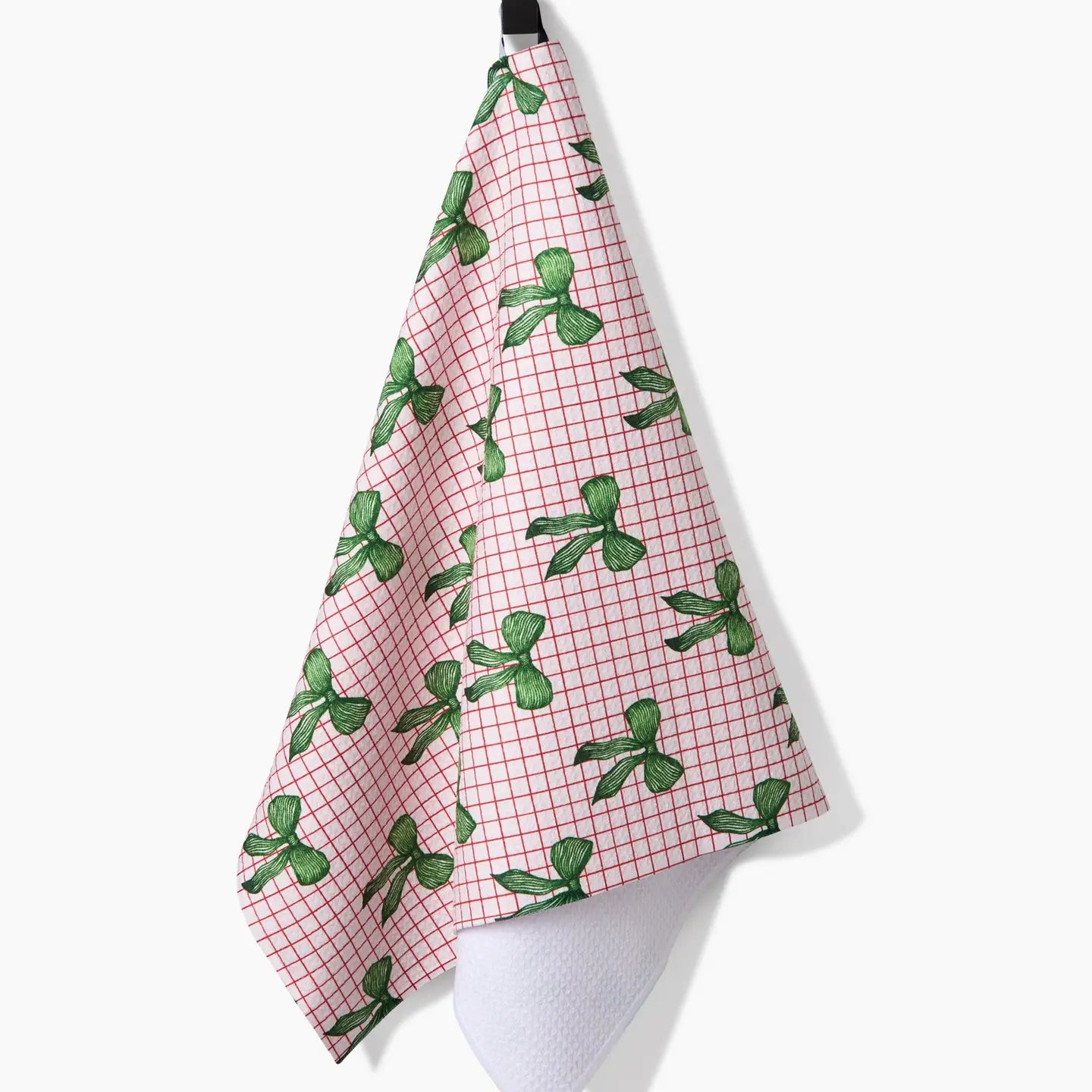 Ribbon & Cheer Tea Towel draped on a hook
