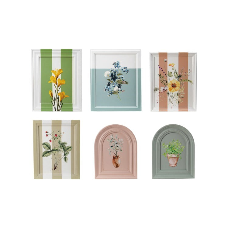 six framed prints with floral and plant designs arranged on a white background