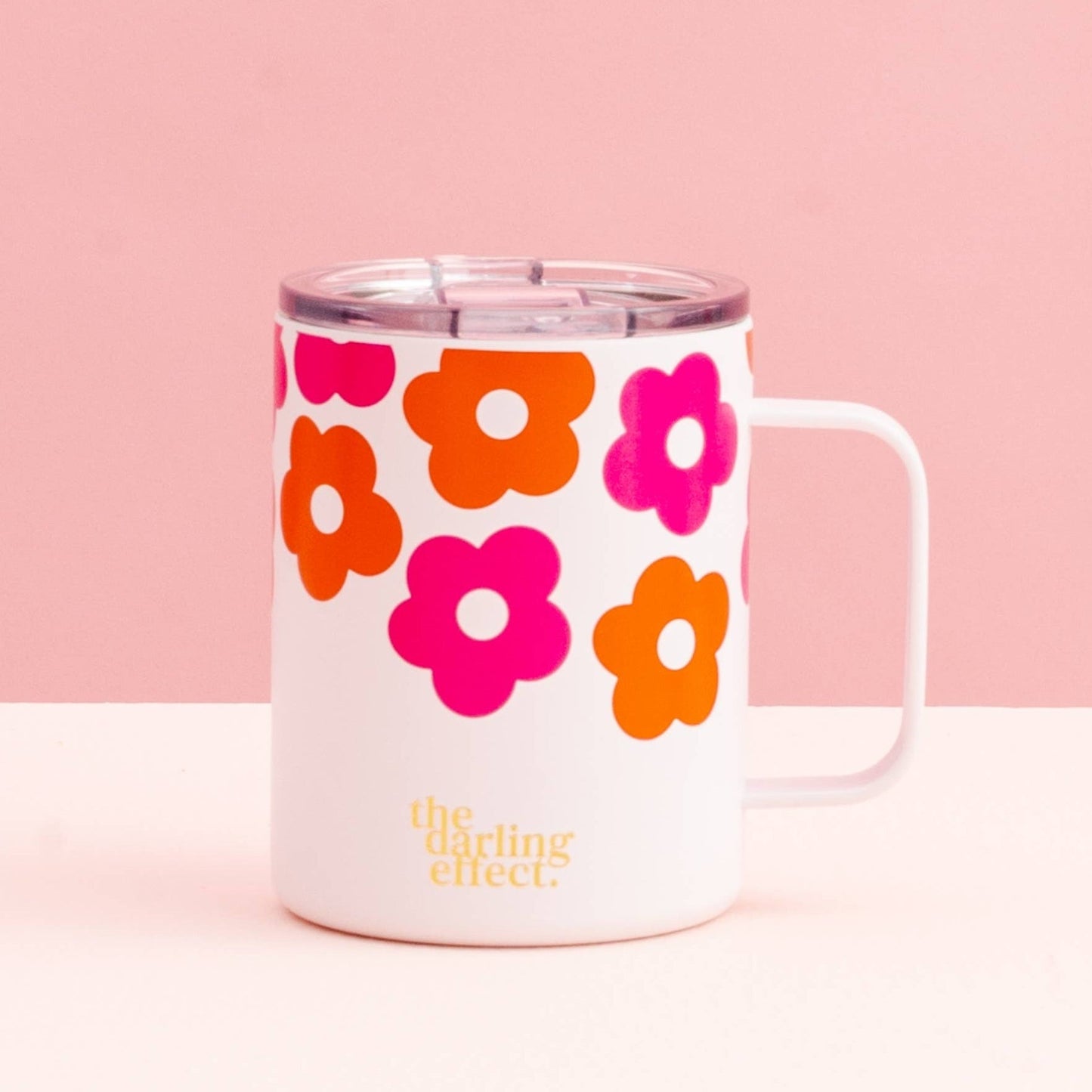 lovebug floral mug on a pink background.