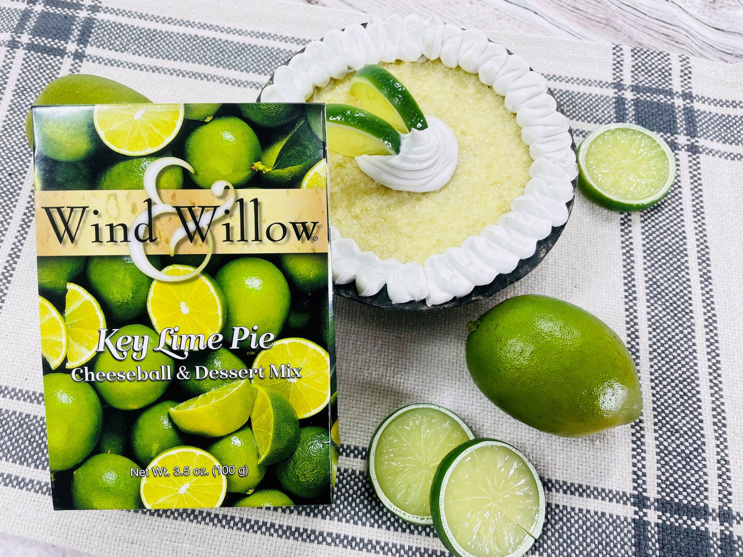  Key Lime Cheeseball & Dessert Mix set next to a  Key Lime pie