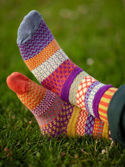 close-up of feet of someone laying in the grass wearing Hazel Crew Socks