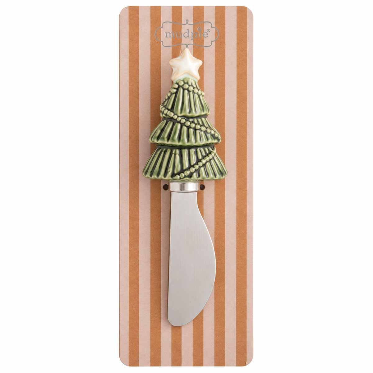 A decorative spreader with a Christmas tree handle, featuring a green tree with a white star topper, mounted on a striped cardboard backing.