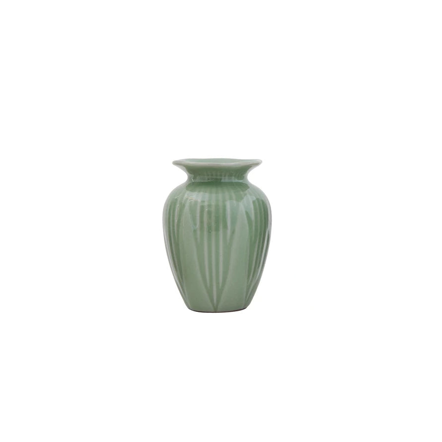 small jade green vase with leaf pattern on a white background