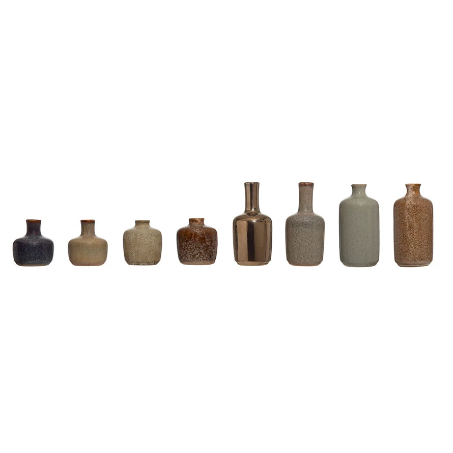 all 8 styles of small stoneware vases displayed against a white background