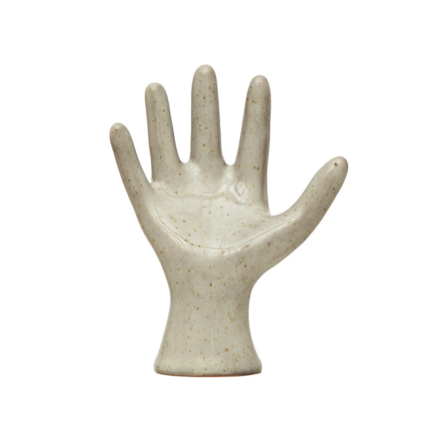 open hand stoneware statue o a white background.