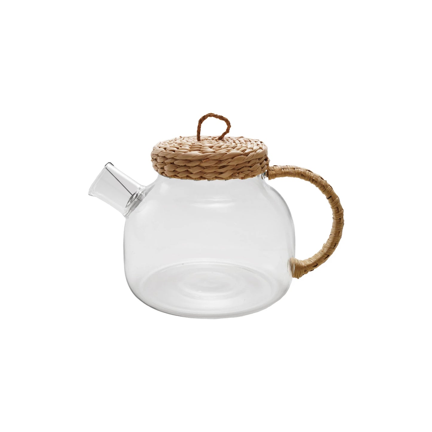 Clear glass teapot with woven lid and handle on a white background