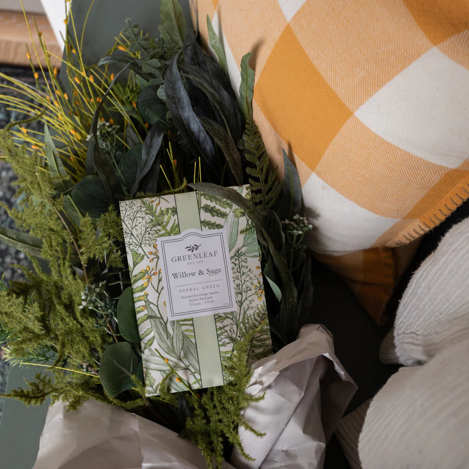 Willow & Sage Large Sachet arranged with greenery and a pillow.