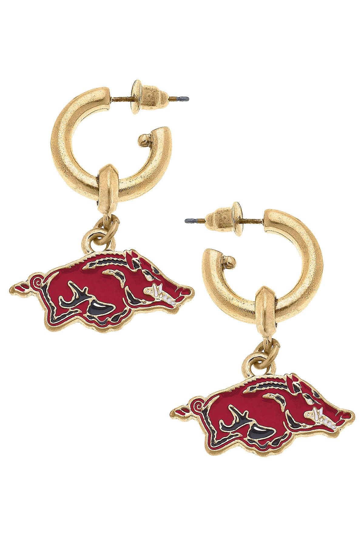 gold hoop earrings with razorback pendants hanging from them.