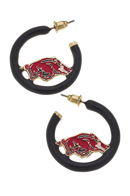 black hoop earrings with enameled razorback pendant in them.