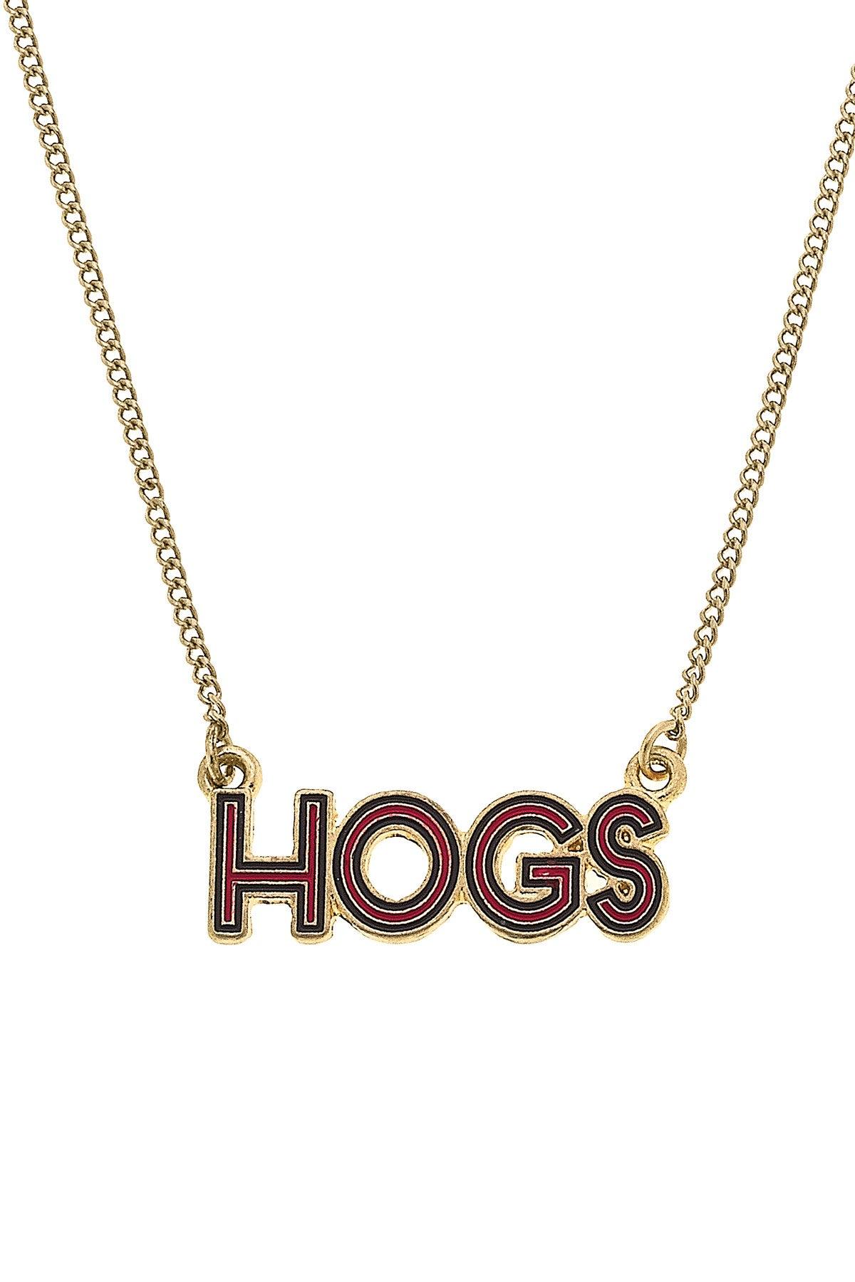 close-up of "HOGS" pendant on gold necklace.