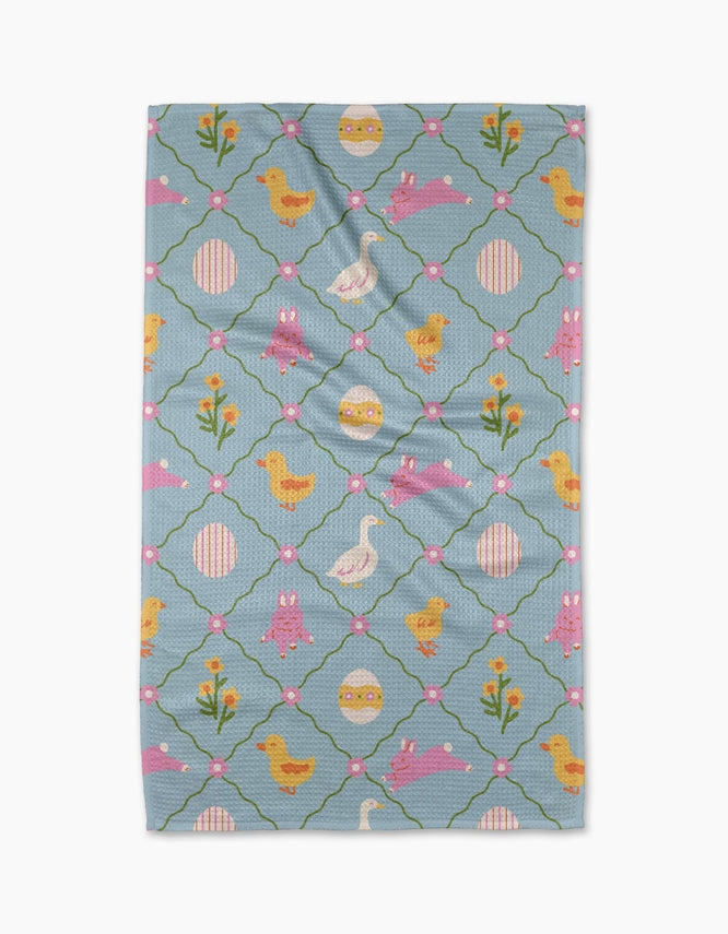 light blue towel with chick, pink bunnies, flowers, and other easter images