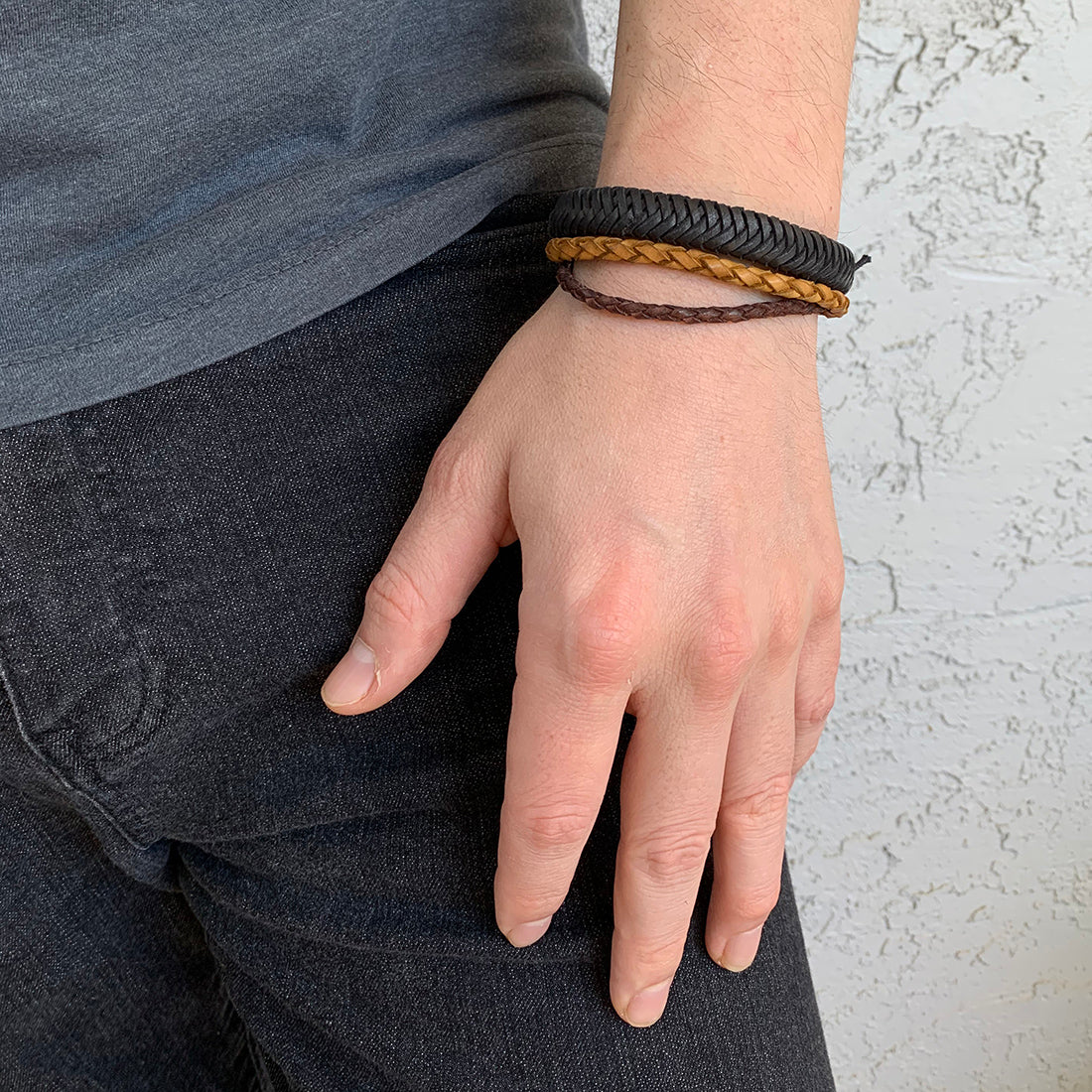 braided leather bracelet on a person's wrist.