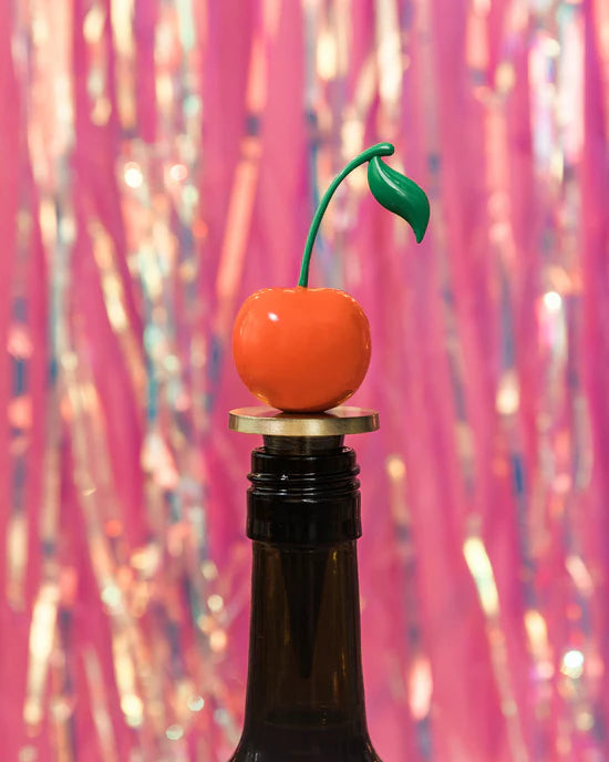 cherry bottle stopper on a bottle.