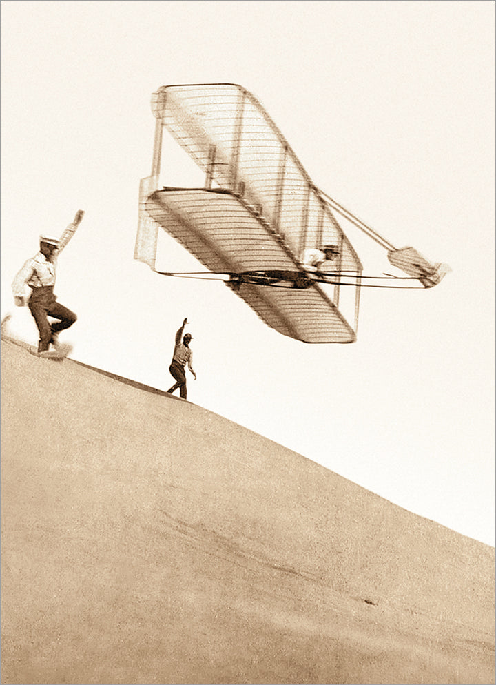 front of card is old black and white phot of wilbur and wright trying to fly the first airplane 
