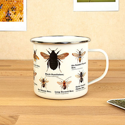 bee mug set on a wooden desk.