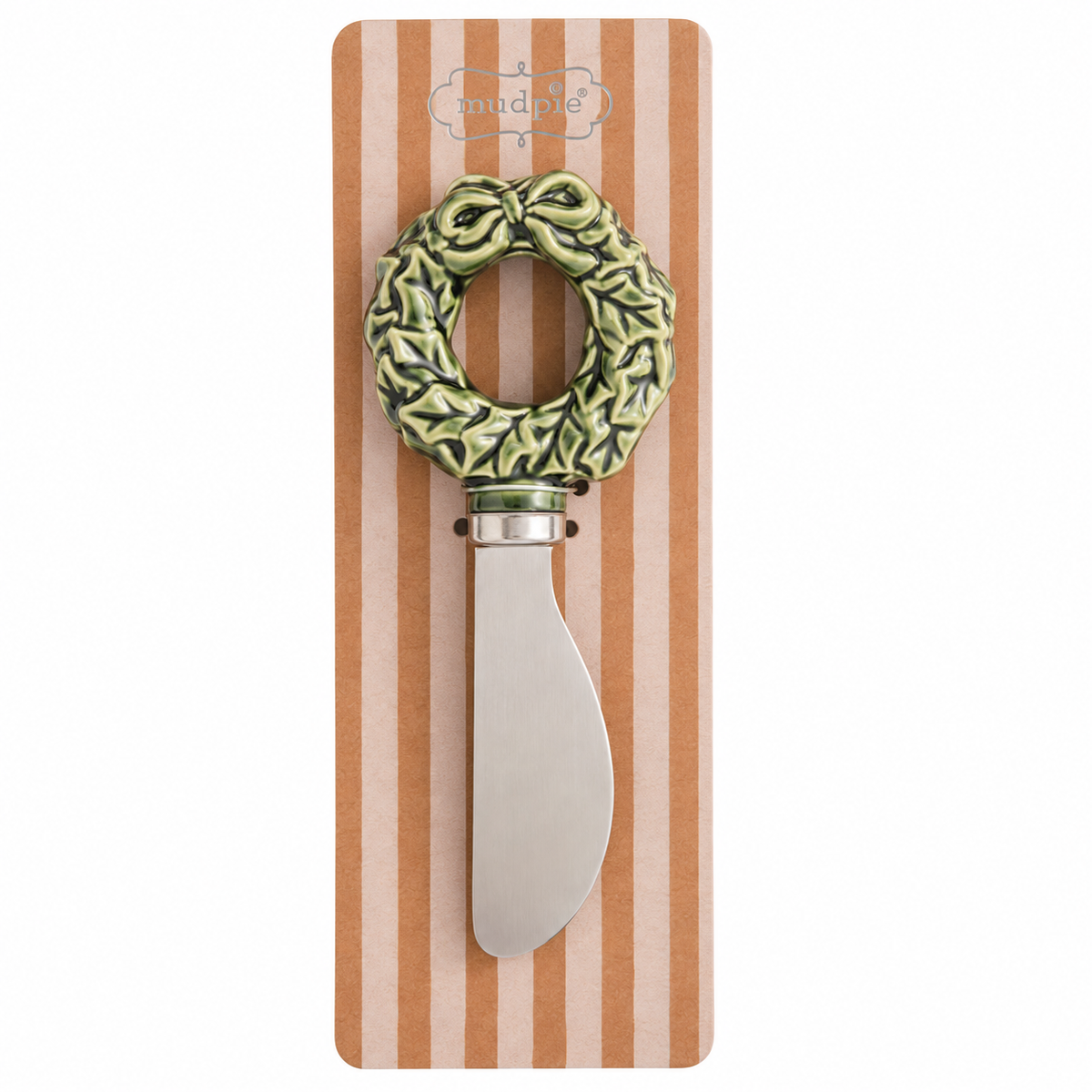 A decorative spreader with a green  patterned wreath-shaped handle and a silver blade, mounted on a brown and cream striped display card. 