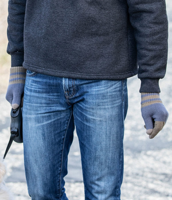 a man walking his dog while wearing the Men's Lodge Gloves