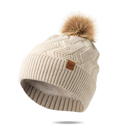 oat  Mainstay Pom Hat with faux fur pom displayed against a white background