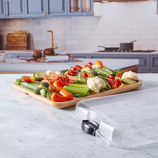 3 Section Build A Board filled with veggies and set on a countertop with lid next to it