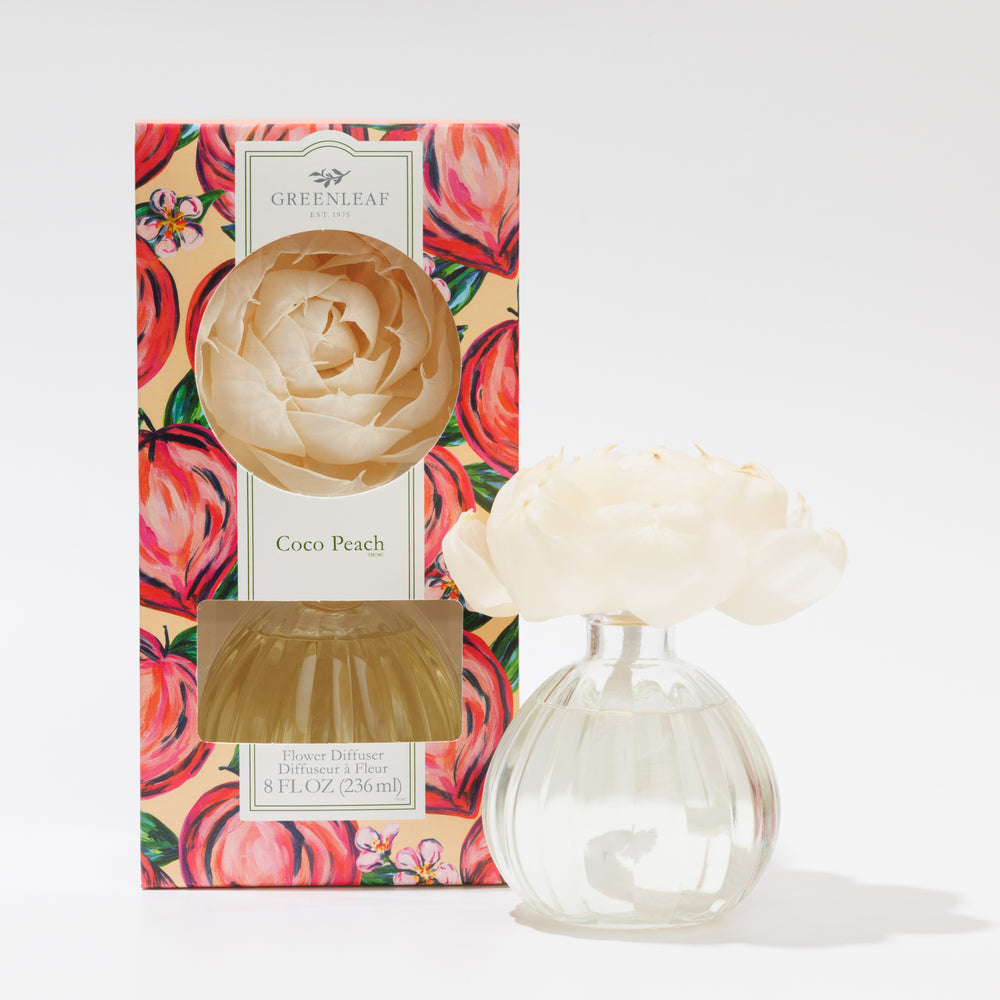 greenleaf coco peach flower diffuser and a diffuser in its box on a white background